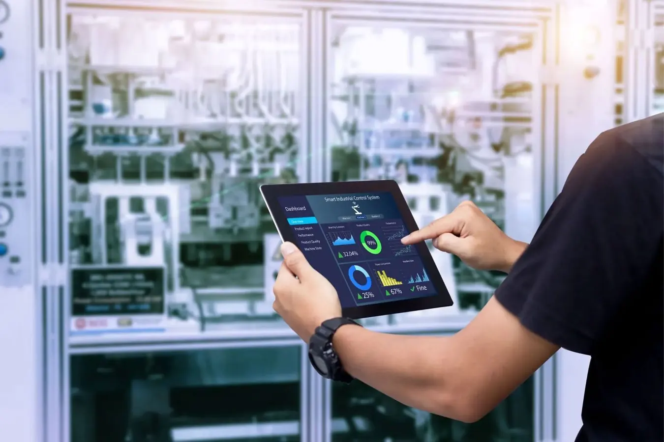 Engineer monitoring an integrated control dashboard on a tablet